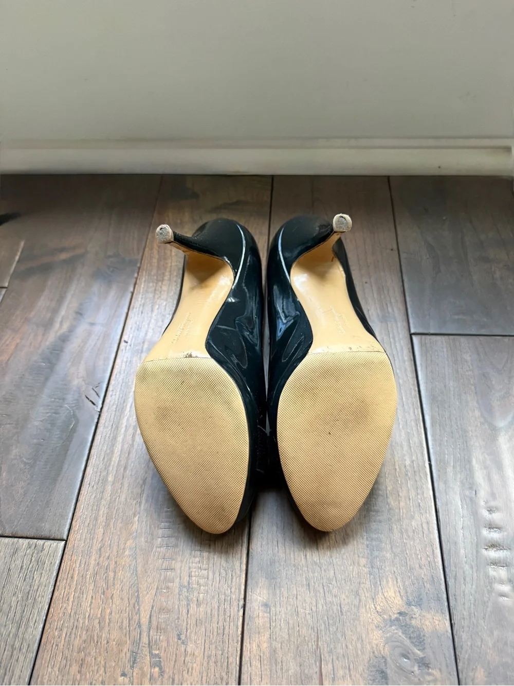 Salvatore Ferragamo Navy Patent Pumps with Navy Bow and Gold Plaque